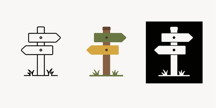Three directional signs stand on grassy areas with arrows pointing different ways.