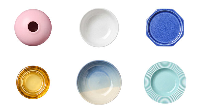 An overhead view of an assorted collection of modern ceramic bowls, plates, and decorative items.