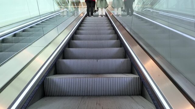 Commuters Riding a Modern Escalator in a Paris Subway Station