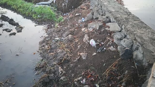 Various types of rubbish on the edge of rice fields in Banyuwangi.