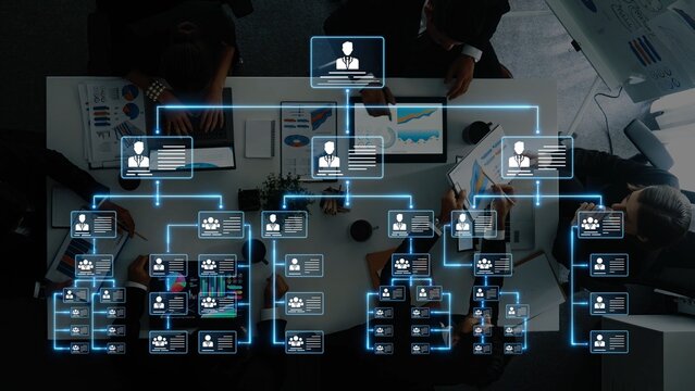 A digital organizational chart showing team members and data visualization, representing business strategies and effective workforce management in an office setting. Raster