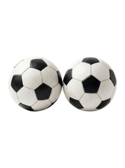 Fototapeta premium Two classic black and white soccer balls are placed side-by-side on a clean white background, highlighting their iconic design in a studio shot.