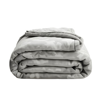A neatly folded stack of gray comforters on a white background