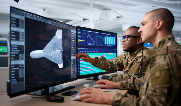 Two Engineers Using Computer Software