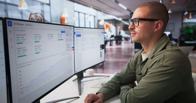 Two Marketing Analysts Work Together On Campaign Data