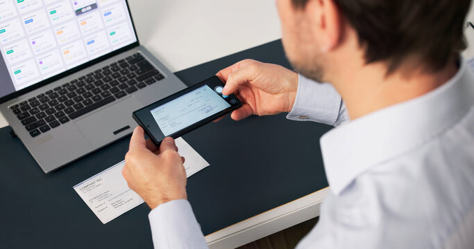 Older Man Uses Smartphone App To Deposit Paycheck Remotely