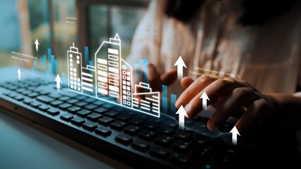 Businessperson Typing on Keyboard with Digital Growth Graphs and City Skyline Overlay Representing...