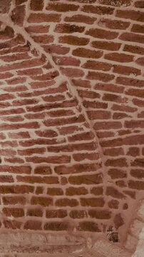 Corner brick wall texture background with rustic masonry pattern loop vertical video