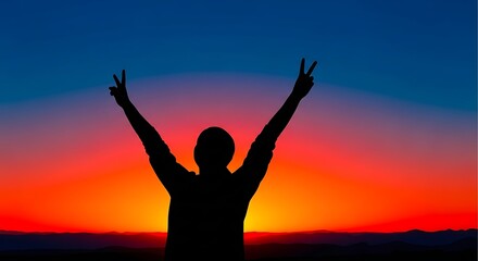Fototapeta premium Silhouette of a person with arms raised in triumph at sunset with vibrant orange and blue sky