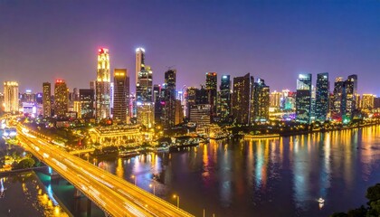 Fototapeta premium Illuminated Singapore city skyline at night with river reflections