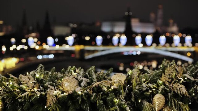 Christmas decorations with Moscow Kremlin and Moskva river lights at night