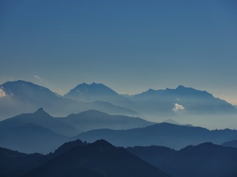 Blue mountain silhouettes, Alpine panorama from the Schafberg with the Berchtesgadener Alps, left Hoher G&ouml;ll, middle Watzmann, right Hochkalter, in front the Osterhorn Group, Salzburger Land, Austria
