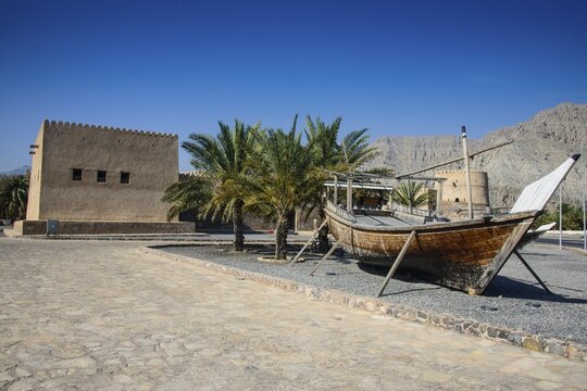 Old dhow in front of Khasab fort, Khasab, Musandam, Oman