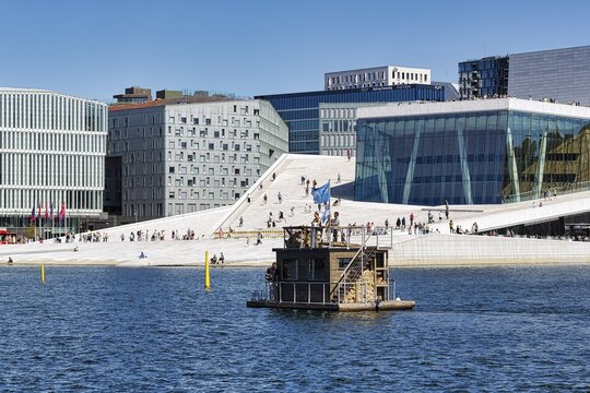 Sauna boat, floating sauna in front of the opera in summer, modern architecture, Bj&oslash;rvika district, city centre, Oslofjord, Oslo, Norway