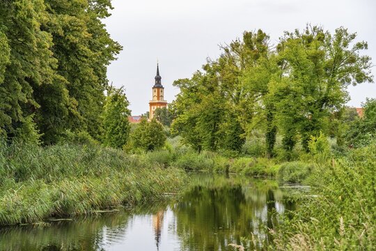 Green landscape along the Templin Canal, St. Mary Magdalene Church in the background, Templin, Uckermark, Brandenburg, Germany