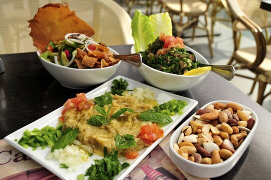 Baba Ganoush, eggplant or aubergine cream, Fattush, bread salad and tabouleh, parsley salad, Arabic mezze, appetizers in a Beirut restaurant, Beirut, Lebanon, Middle East, Asia