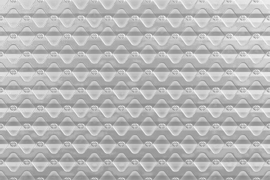 Texture, sfondo, primo piano. Risorsa grafica per sfondo in alta definizione. Primo piano di superficie di metallo a disegni geometrici.