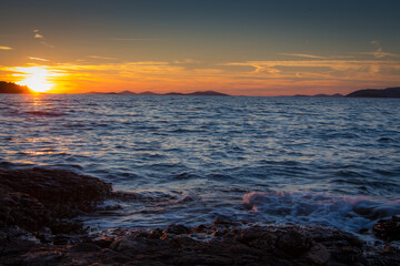 Fototapeta premium Panorama of the sea sunset, beautiful sunset at the Adriatic sea, dalmatia, Croatia