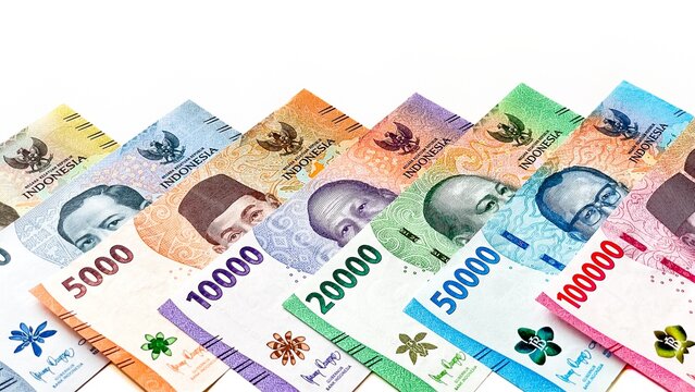 A detailed view of Indonesian rupiah banknotes in various denominations and colors. A look at the country's financial and economic issues.