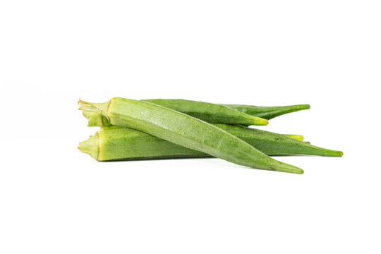 Fresh green okra pods isolated on white background