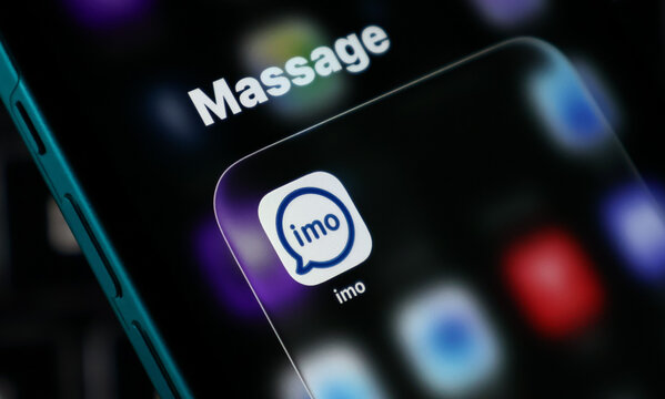 Closeup of the imo messaging app icon on a smartphone screen, representing mobile communication and social media technology