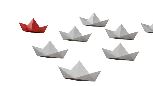 group of paper boats on a white background. concept of a strong leader in a team, manipulation of the masses, following new perspectives, collaboration and unification. Startup