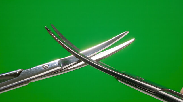 Industrial metal mallet and chisel tools intersecting on a vivid green studio background.