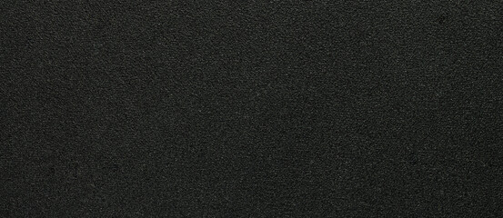 Fototapeta premium Black fabric texture background with dark woven textile surface