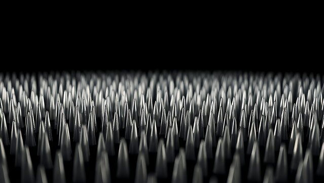 A field of sharp silver line tips densely arranged against a black background.