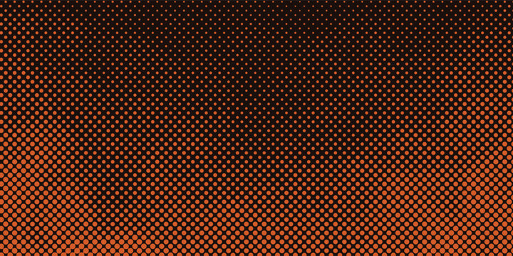 Close-up of orange hexagonal perforated metal with gradient lighting.