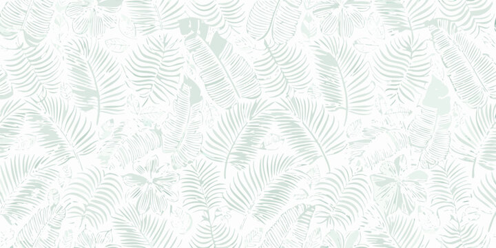 seamless repeating pattern of soft mint green tropical leaves and foliage