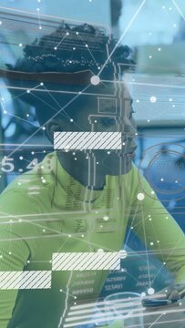 Vertical video: Woman sitting at biz cafe hearing offscreen voice as nodes sliding obscuring face