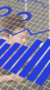 Vertical video: Two colleagues watching grid appearing and overlaying tech bars line pie for review