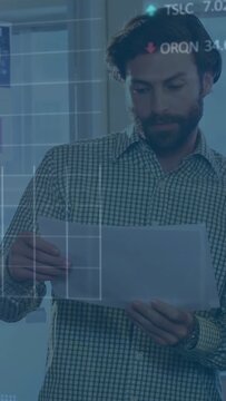 Vertical video: Woman handing sheet man scanning charts reviewing finance while overlays matching