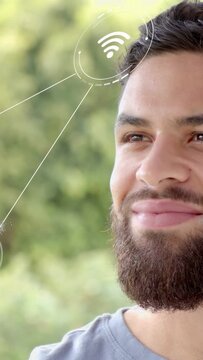 Vertical video: Adult man turning and smiling, as tech nodes moving toward eye showing connection