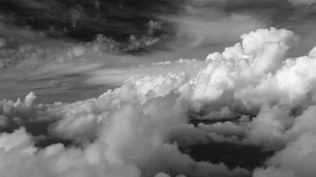 1940's style black and white  film of flying in the clouds 
