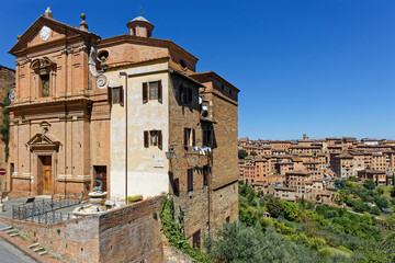 Naklejka premium Church and a view on Siena. The city was an important city in medieval Europe, and its historic centre is a UNESCO World Heritage Site