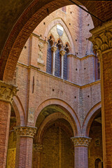 Fototapeta premium Architectural detail of Palazzo Pubblico, historic palace on the Piazza del Campo in Siena. It is one of the principal landmarks of the historic center.