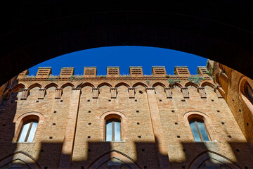 Fototapeta premium Architectural detail of Palazzo Pubblico, historic palace on the Piazza del Campo in Siena. It is one of the principal landmarks of the historic center.