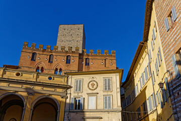 Fototapeta premium SIENA, ITALY, April 24, 2026 : Old Renaissance houses facades in the olf town of Siena, Italy