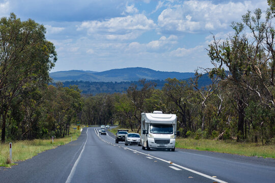 Campervan traveling along highway road going on holiday trip