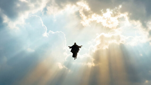 The glorious ascension of Jesus Christ into a heavenly sky with bright god rays and ethereal clouds. A symbol of faith and hope