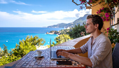 Fototapeta premium Young professional works on a laptop from a beautiful balcony overlooking the turquoise sea. A perfect representation of the digital nomad lifestyle, remote work, and ideal worklife balance.