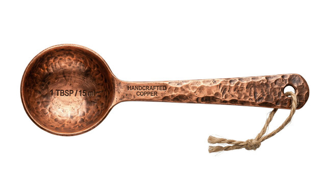 Handcrafted copper measuring spoon with hammered texture, rustic 1 TBSP metal scoop for cooking, vintage kitchen utensil isolated on white background