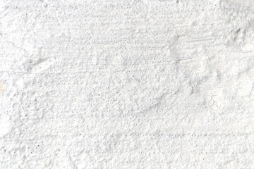 Obraz premium White powder texture on rough surface background in studio close up. Minimal abstract backdrop, monochrome texture, copy space, neutral surface.