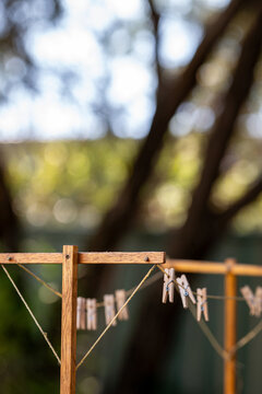 Old fashioned string clothes line with wooden pegs