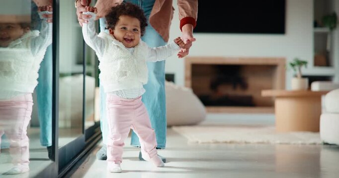 Mother, baby and holding hands in home with walking support, bonding together and child development. Mom, happy daughter and learning coordination in house with steps, parent help and infant growth.