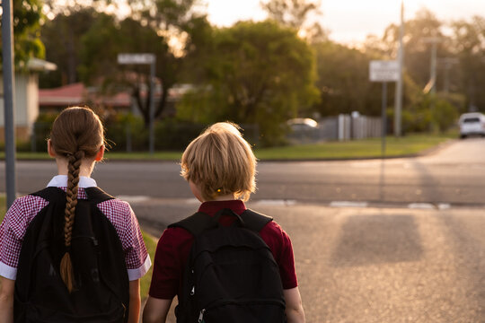 kids in school uniform walking together in golden light