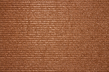 The texture is brown carpet.Self-adhesive scratching post for cats.Durable carpet for cats. © begun1983
