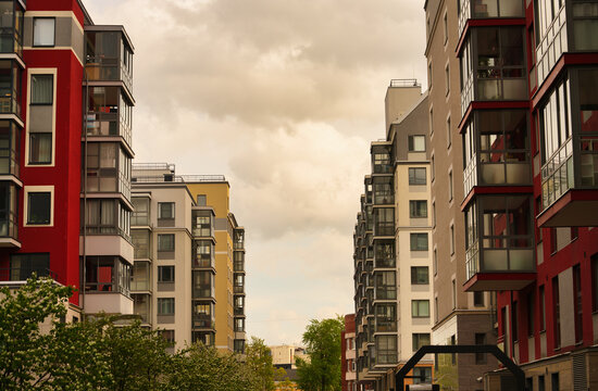 Modern buildings of different colors on the city street